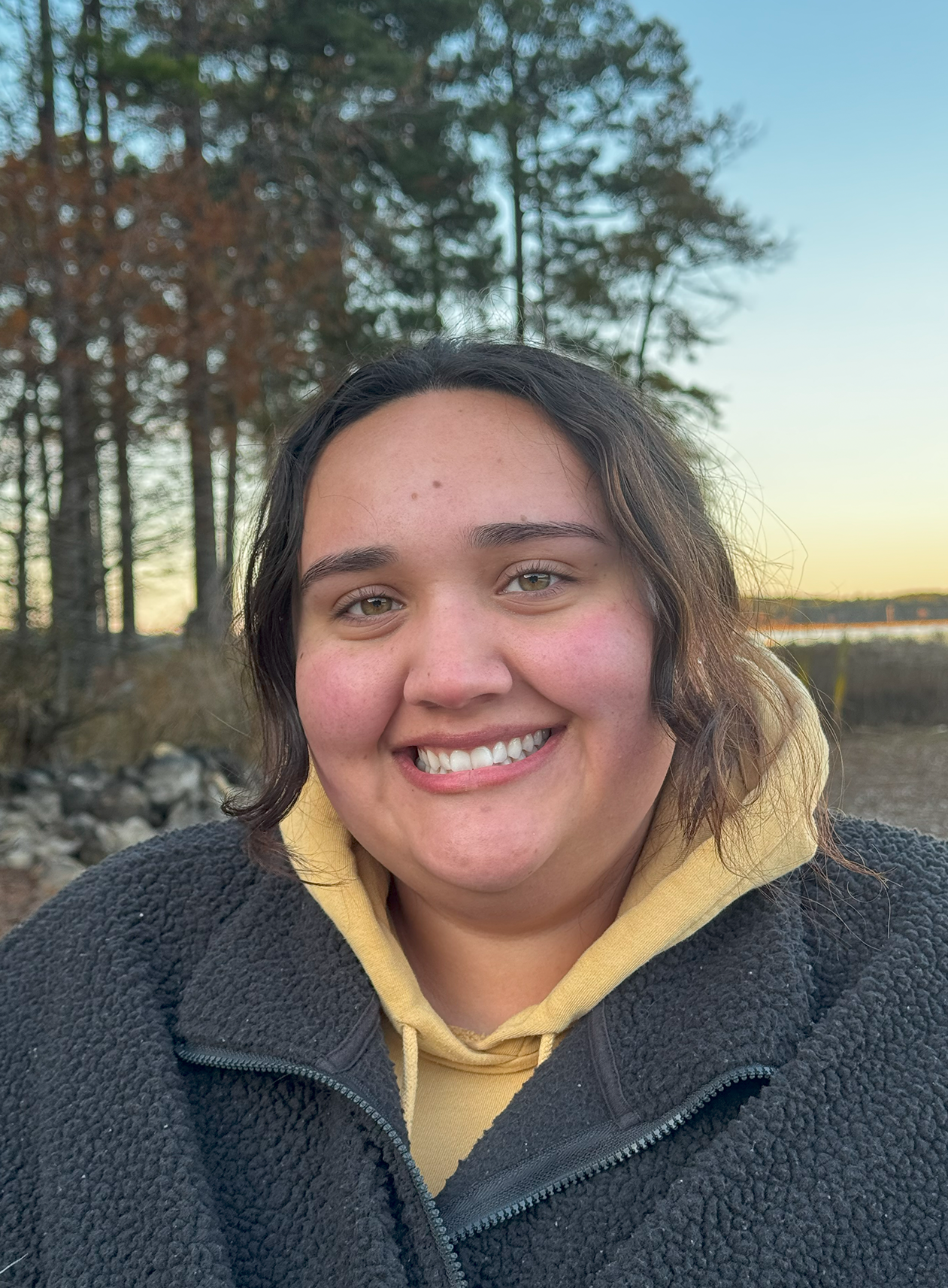 girl smiling at the lake